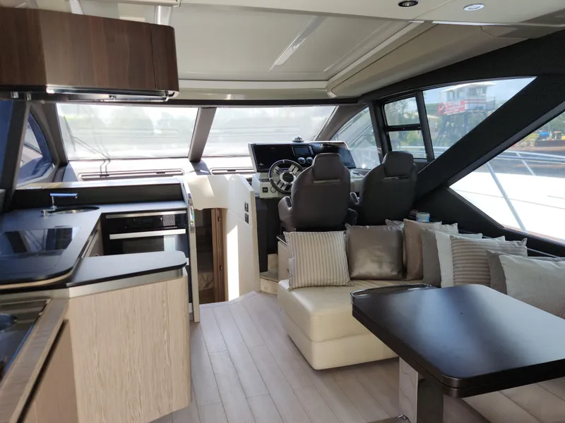 Slide: The Image of Luxurious interior of 2019 Azimut S6 yacht with modern seating and helm. - 7
