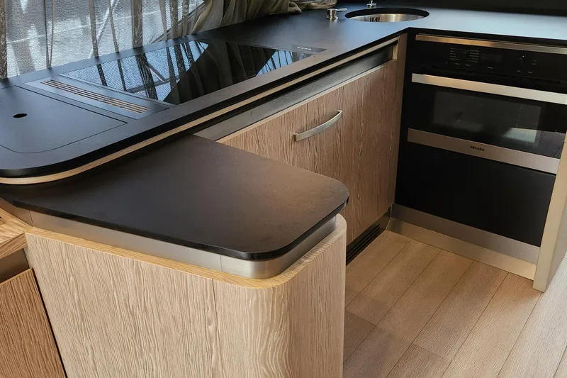 Slide: The Image of Modern kitchen interior of 2019 Azimut S6 yacht with sleek countertops and appliances. - 9