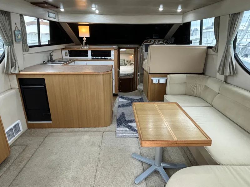 Slide: The Image of Interior of a 2000 Bayliner 3788 Command Bridge Motoryacht with kitchen and seating area. - 15