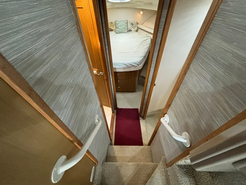Slide: The Image of Stairway leading to the bedroom in a 2000 Bayliner 3788 Command Bridge Motoryacht. - 20