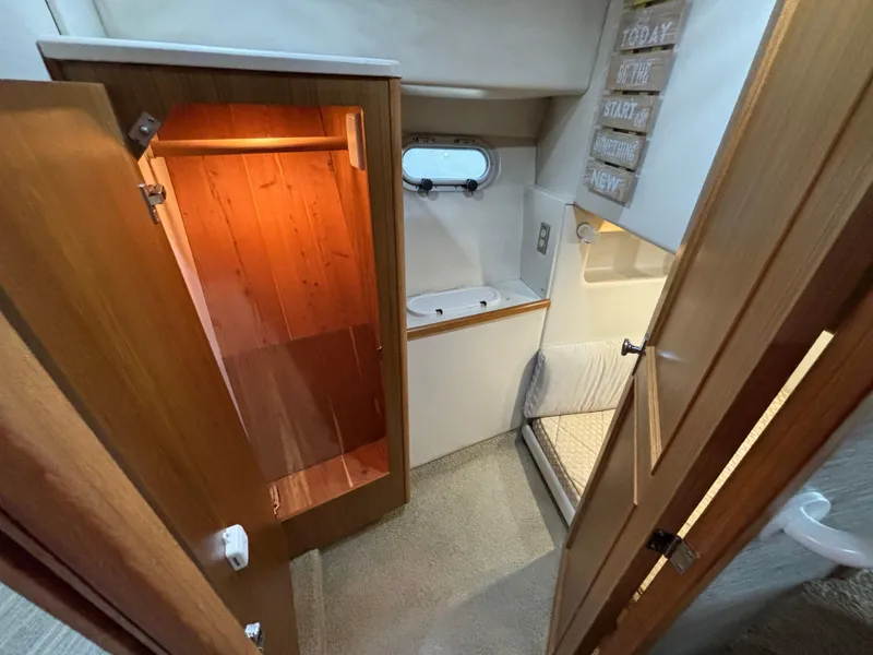 Slide: The Image of Interior of 2000 Bayliner 3788 Command Bridge Motoryacht with closet and seating area. - 27