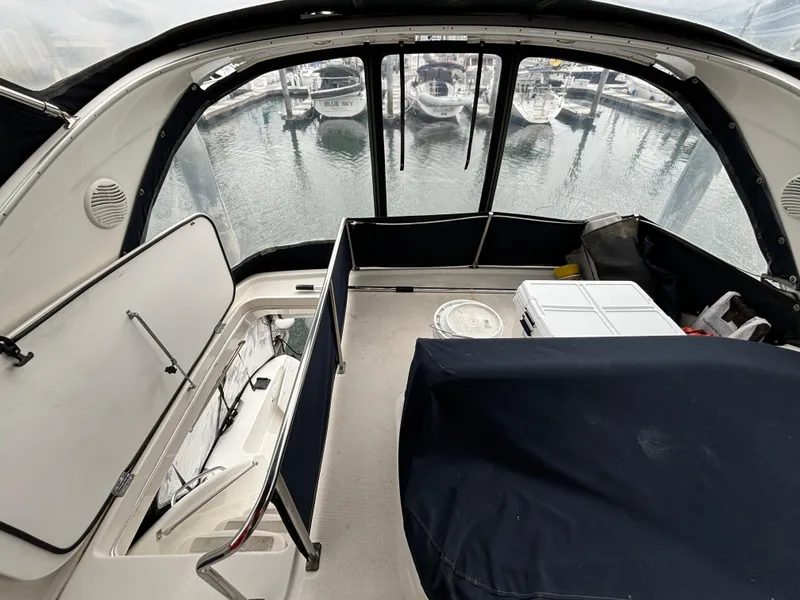 Slide: The Image of Interior view of 2000 Bayliner 3788 Command Bridge Motoryacht with marina background. - 45