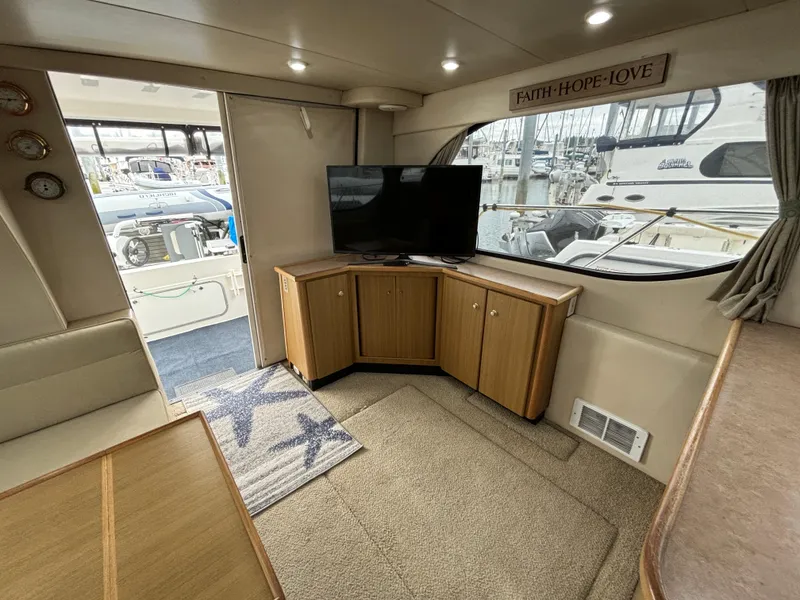 Slide: The Image of Interior of 2000 Bayliner 3788 Command Bridge Motoryacht with TV and cabinets. - 9