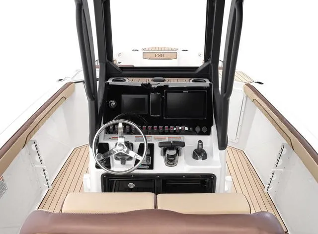 Slide: The Image of 2024 Yamaha Boats 255 FSH Sport H helm with dual displays and controls. - 11
