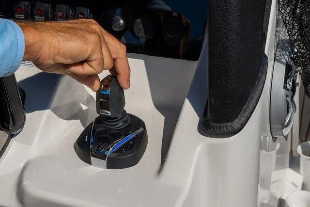 Slide: The Image of Hand operating joystick control on 2024 Yamaha Boats 255 FSH Sport H. - 13