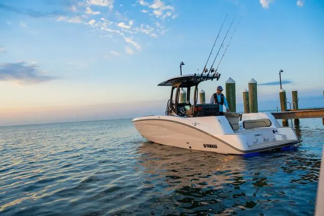 Slide: The Image of 2024 Yamaha Boats 255 FSH Sport H docked at sunset. - 15