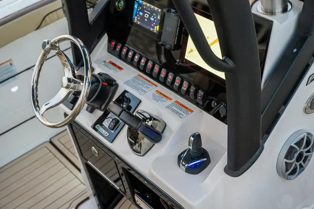 Slide: The Image of 2024 Yamaha Boats 255 FSH Sport H helm with advanced controls and touchscreen display. - 17