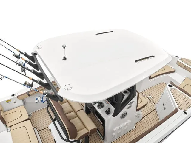 Slide: The Image of 2024 Yamaha Boats 255 FSH Sport H center console with fishing rod holders. - 8