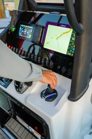 Slide: The Image of 2024 Yamaha Boats 255 FSH Sport H dashboard with navigation screens and controls. - 9