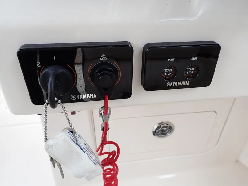 Slide: The Image of Yamaha ignition and control panel on 2019 Grady-White Freedom 275 boat. - 23