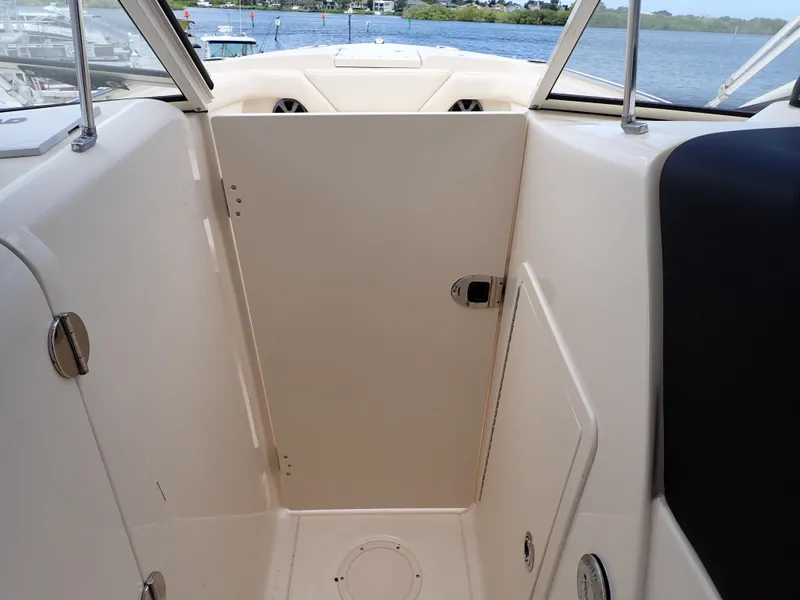 Slide: The Image of 2019 Grady-White Freedom 275 boat interior with closed cabin door. - 29