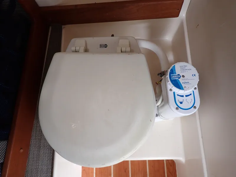 Slide: The Image of 2019 Grady-White Freedom 275 boat toilet with manual flush system. - 36