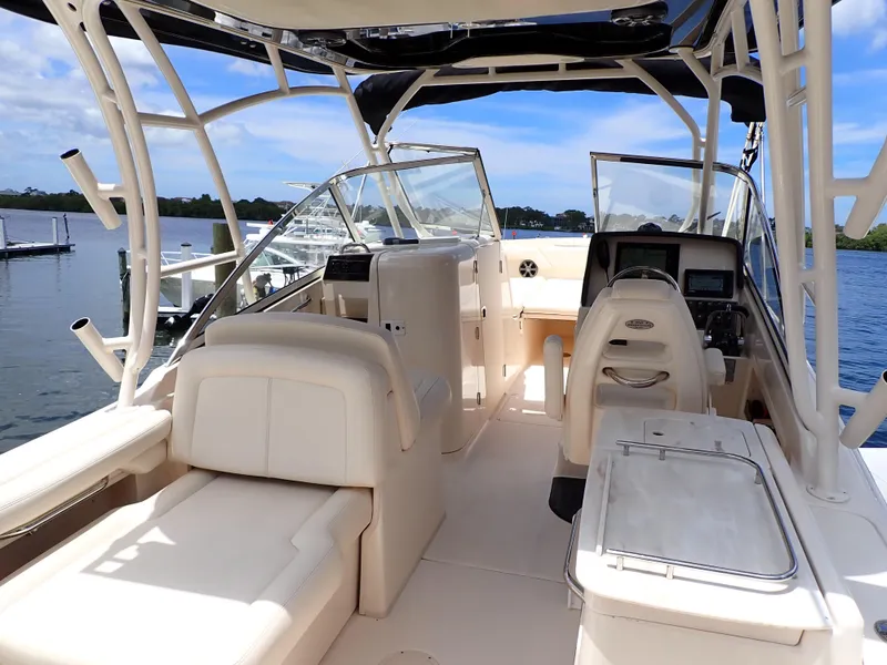 Slide: The Image of 2019 Grady-White Freedom 275 boat interior with seating and control console. - 4
