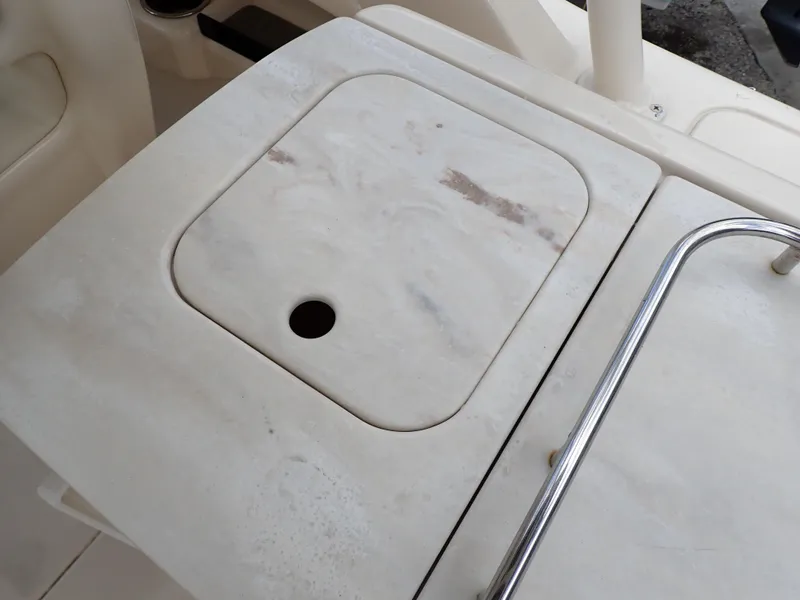 Slide: The Image of 2019 Grady-White Freedom 275 boat deck with storage compartment. - 44