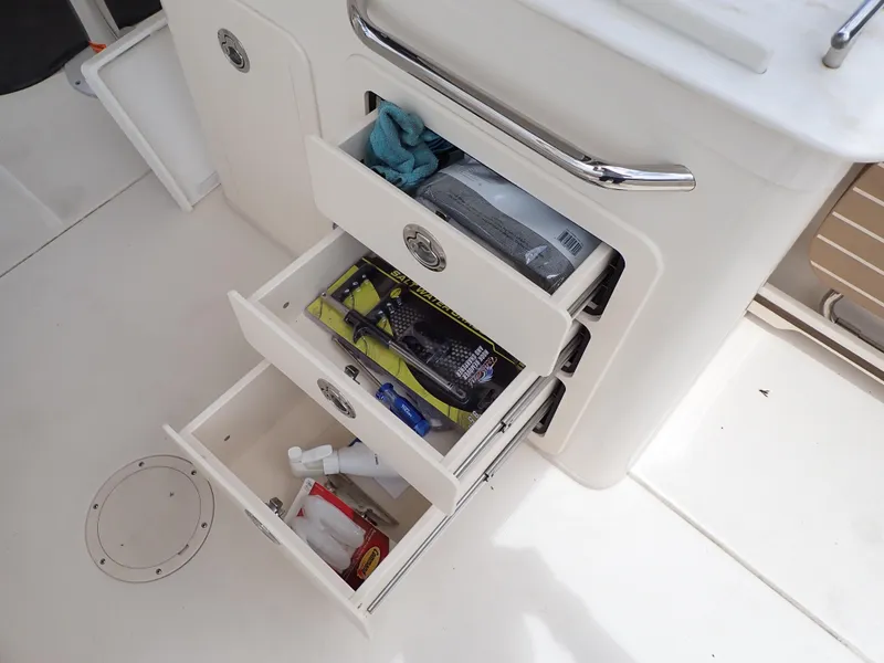 Slide: The Image of Open storage drawers on a 2019 Grady-White Freedom 275 boat. - 46