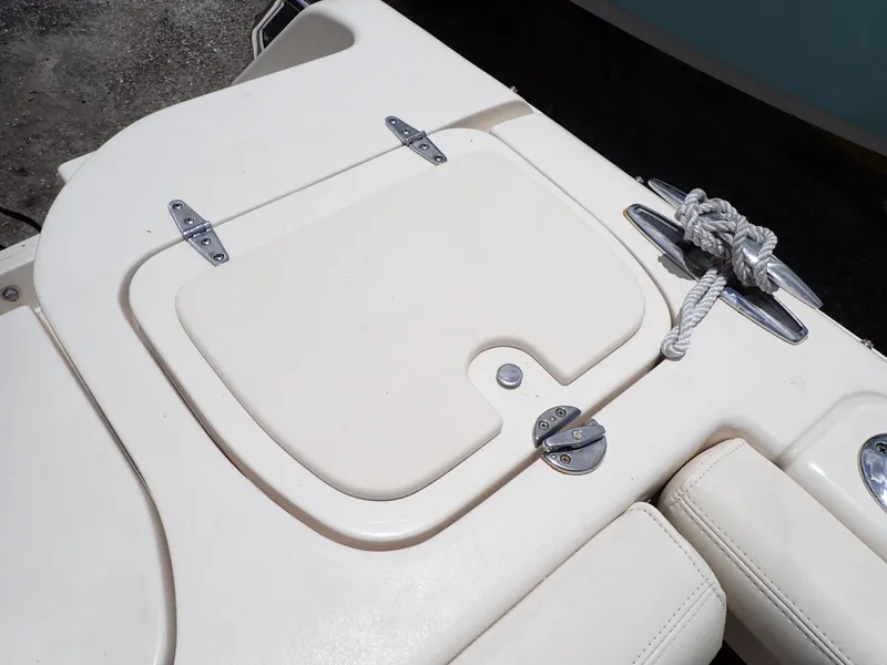 Slide: The Image of 2019 Grady-White Freedom 275 boat deck with storage compartment and rope. - 49