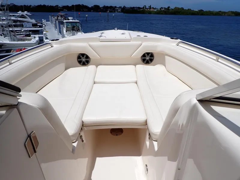 Slide: The Image of 2019 Grady-White Freedom 275 boat interior with white cushioned seating. - 7