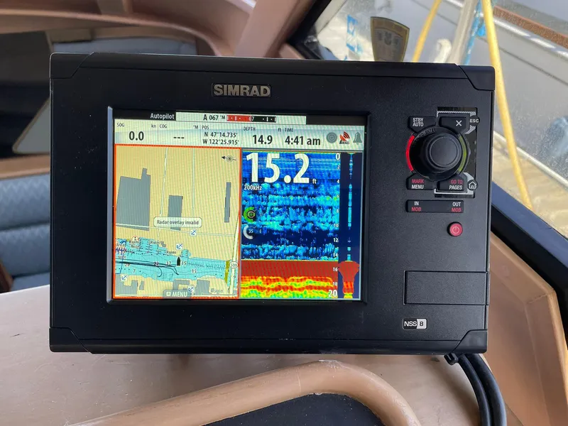 Slide: The Image of Simrad navigation system on 1994 Queenship Motor Yacht displaying sonar and map data. - 14