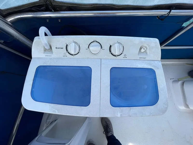Slide: The Image of Portable washing machine on 1994 Queenship Motor Yacht deck. - 21