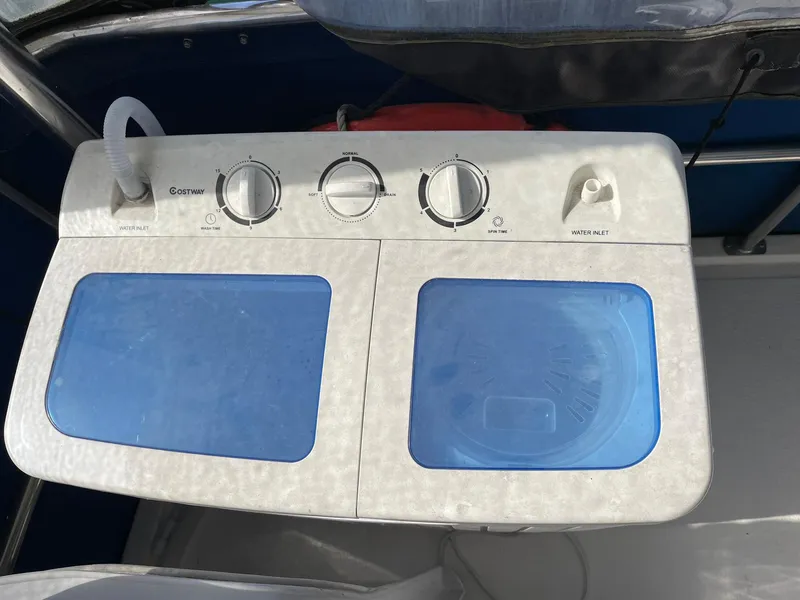 Slide: The Image of Compact washing machine on 1994 Queenship Motor Yacht deck. - 29