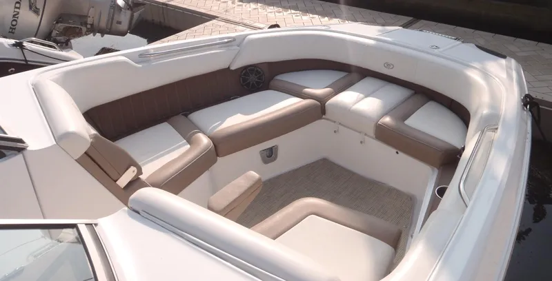 Slide: The Image of 2013 Cobalt 26SD boat interior with cushioned seating and modern design. - 13