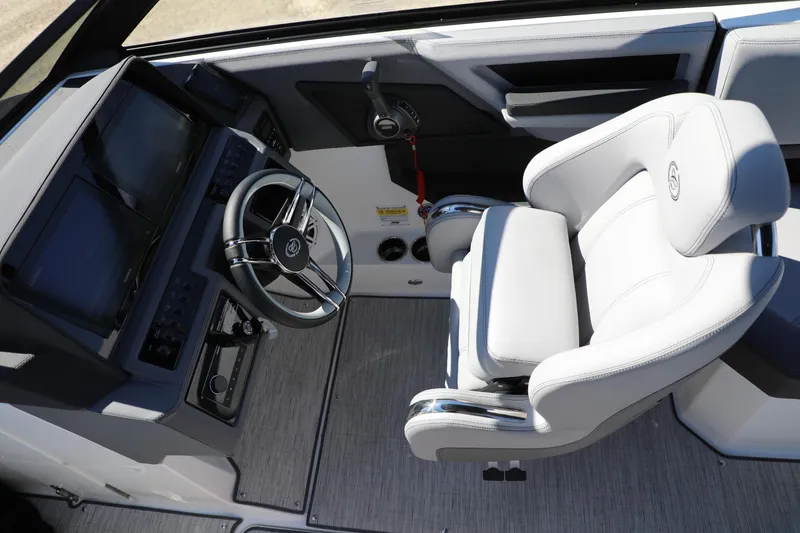 Slide: The Image of 2024 Cobalt R4 boat cockpit with modern steering and luxurious seating. - 10