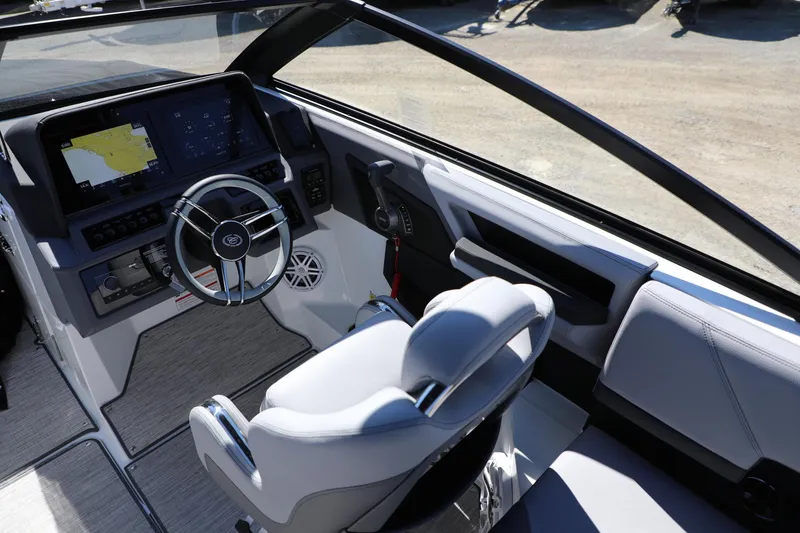 Slide: The Image of 2024 Cobalt R4 boat cockpit with modern steering and navigation system. - 11