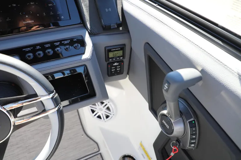 Slide: The Image of 2024 Cobalt R4 boat dashboard with Garmin display and control panel. - 12