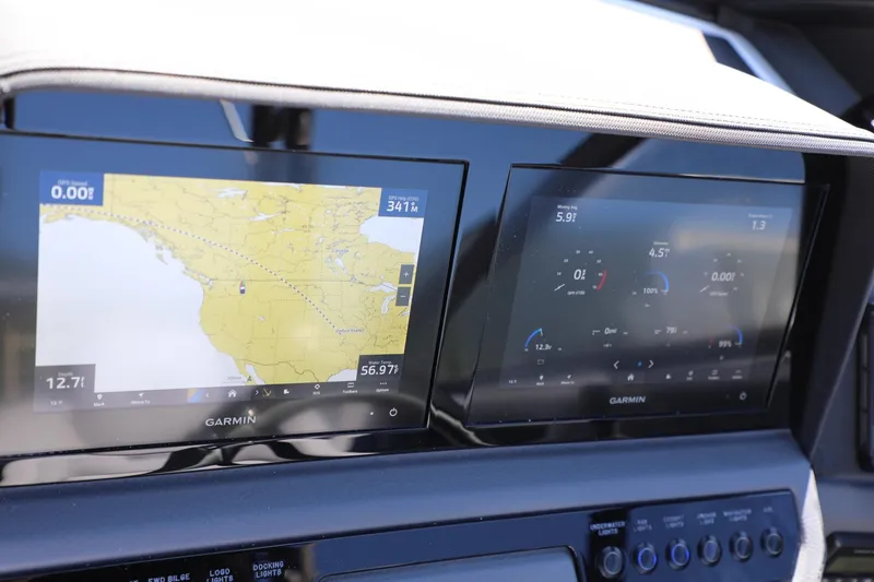 Slide: The Image of 2024 Cobalt R4 dashboard with dual Garmin navigation displays. - 13