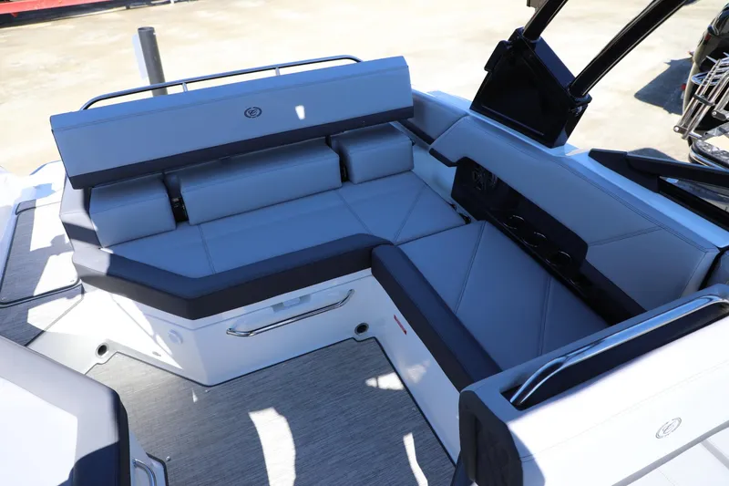 Slide: The Image of 2024 Cobalt R4 boat interior with sleek gray seating and modern design. - 15