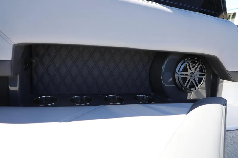 Slide: The Image of 2024 Cobalt R4 boat interior with cup holders and speaker. - 18