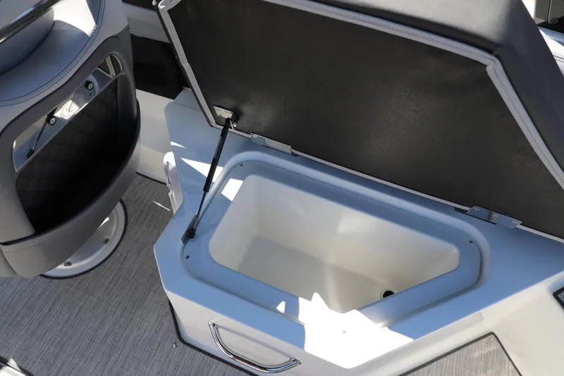 Slide: The Image of 2024 Cobalt R4 boat interior with open storage compartment and seating. - 19