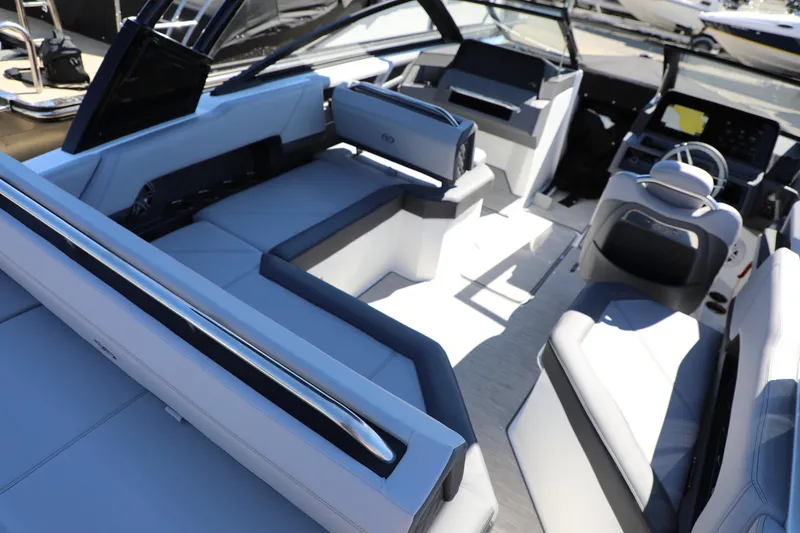 Slide: The Image of 2024 Cobalt R4 boat interior with luxurious seating and modern dashboard design. - 7