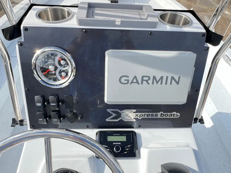 Slide: The Image of Control panel of 2025 Xpress H22B Hyper-Lift Bay boat with Garmin display. - 11