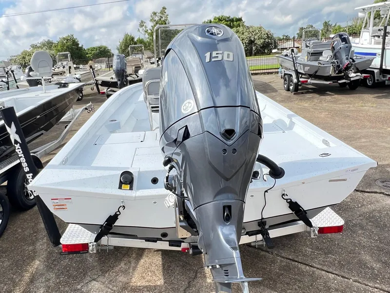 Slide: The Image of 2025 Xpress H22B Hyper-Lift Bay boat with Yamaha 150 outboard motor. - 14