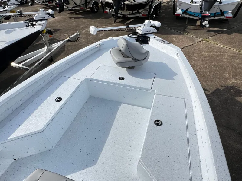 Slide: The Image of 2025 Xpress H22B Hyper-Lift Bay boat, front deck view with seating and storage compartments. - 3