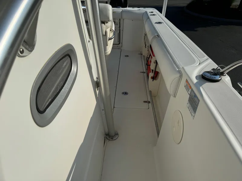 Slide: The Image of 2007 Boston Whaler 270 Outrage boat interior, showing side deck and seating area. - 11