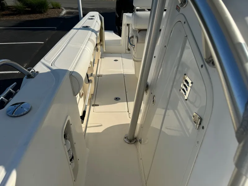 Slide: The Image of 2007 Boston Whaler 270 Outrage boat deck with seating and storage compartments. - 12