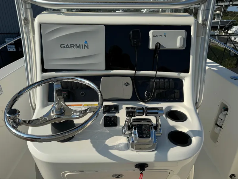 Slide: The Image of Control console of a 2007 Boston Whaler 270 Outrage with Garmin navigation system. - 14