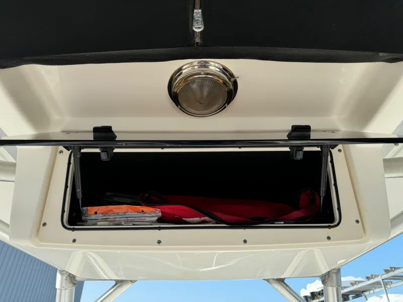 Slide: The Image of Storage compartment on a 2007 Boston Whaler 270 Outrage boat. - 16