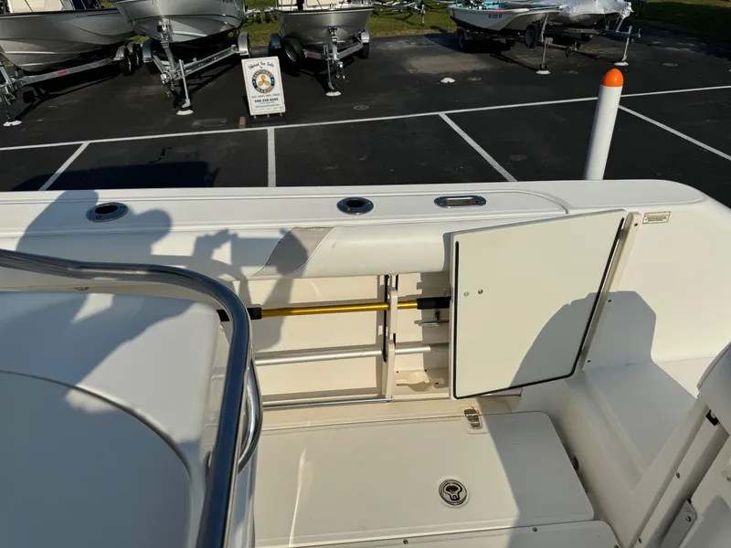 Slide: The Image of 2007 Boston Whaler 270 Outrage boat interior with storage compartments. - 21