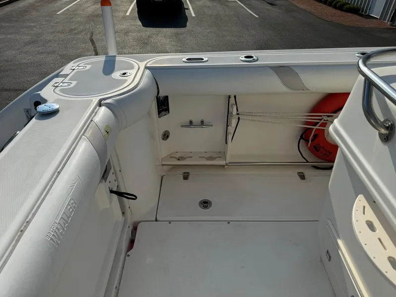 Slide: The Image of 2007 Boston Whaler 270 Outrage boat interior, showing seating and storage compartments. - 22
