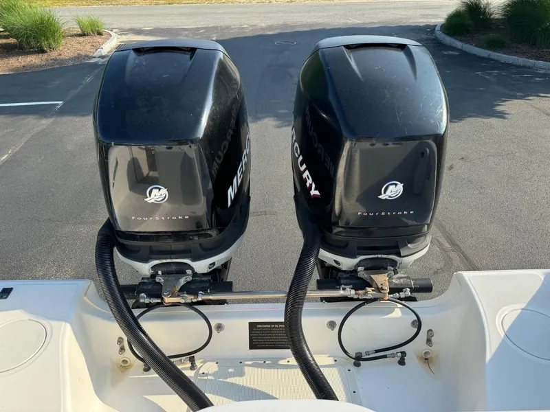 Slide: The Image of Twin Mercury outboard engines on a 2007 Boston Whaler 270 Outrage boat. - 25
