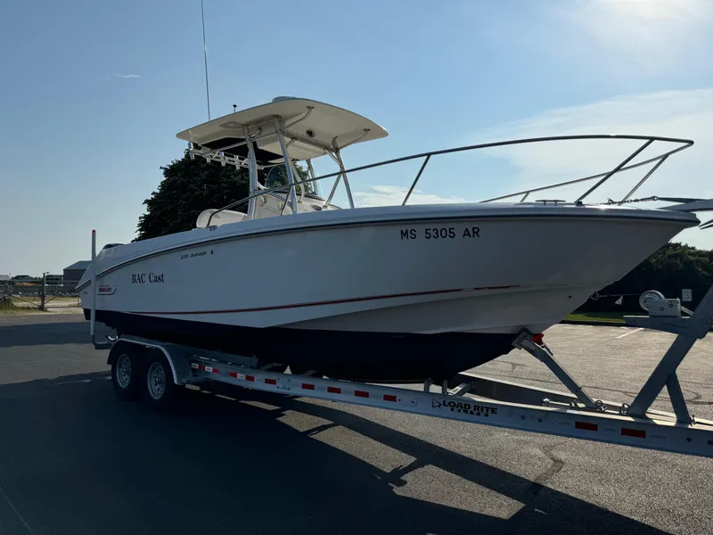 Slide: The Image of 2007 Boston Whaler 270 Outrage on trailer in outdoor setting. - 4