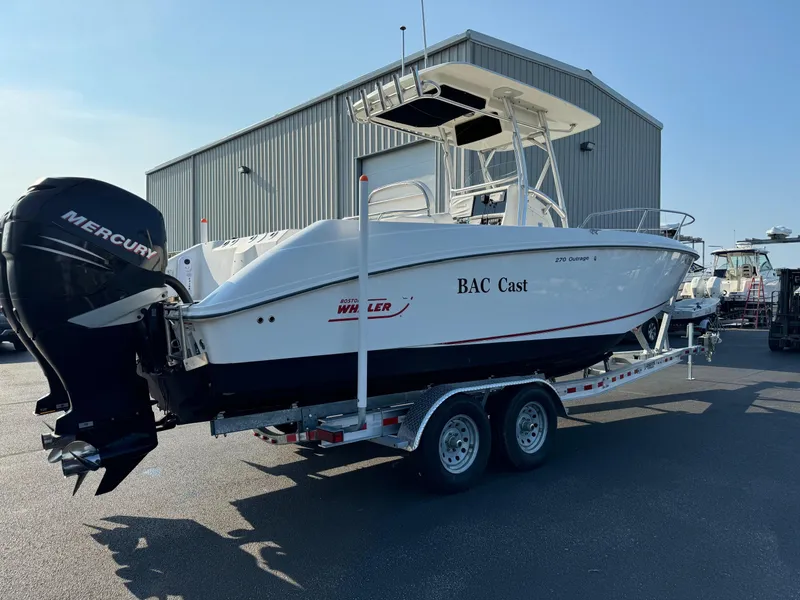 Slide: The Image of 2007 Boston Whaler 270 Outrage boat on a trailer with Mercury outboard engines. - 5