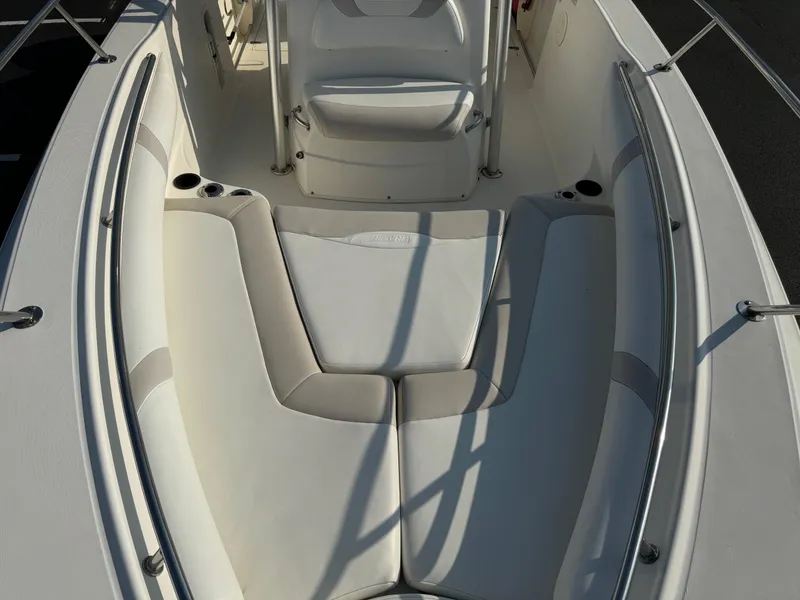 Slide: The Image of 2007 Boston Whaler 270 Outrage boat interior with cushioned seating. - 8