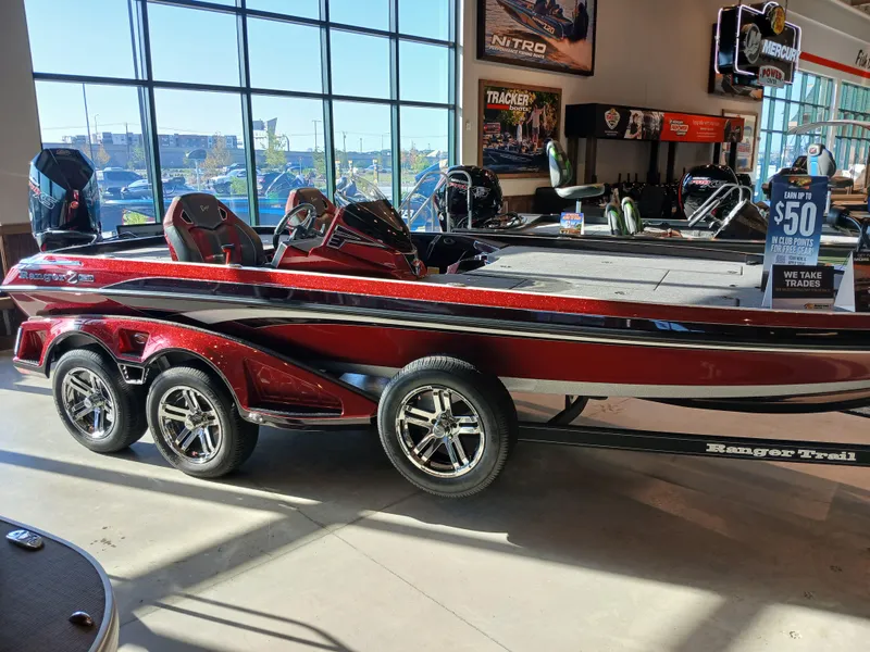 Slide: The Image of 2024 Ranger Z521R Ranger Cup Equipped boat in showroom, red and black design. - 0
