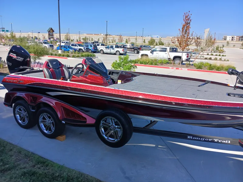 Slide: The Image of 2024 Ranger Z521R Ranger Cup Equipped boat on display in parking lot. - 1