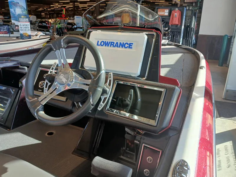 Slide: The Image of 2024 Ranger Z521R boat dashboard with Lowrance electronics and steering wheel. - 16
