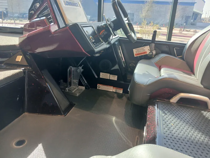 Slide: The Image of 2024 Ranger Z521R Ranger Cup Equipped boat interior with steering wheel and seating. - 19